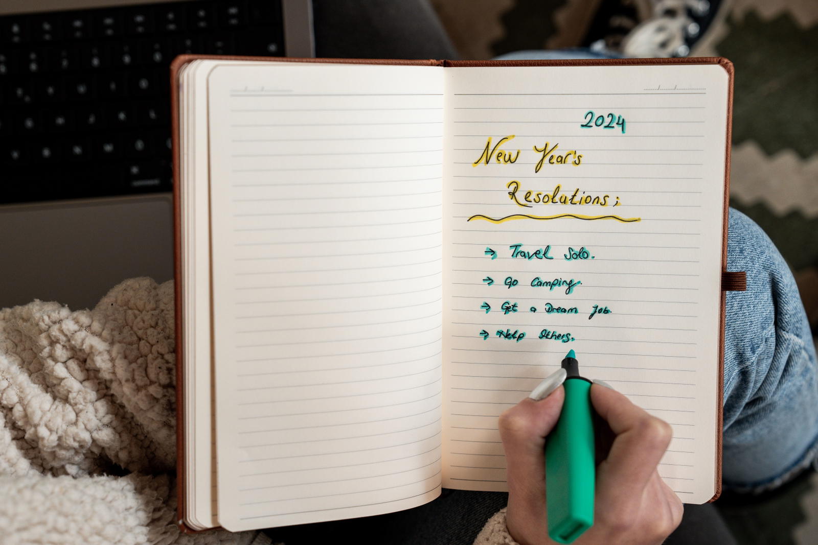 Woman writing anchor words in a notebook before speaking