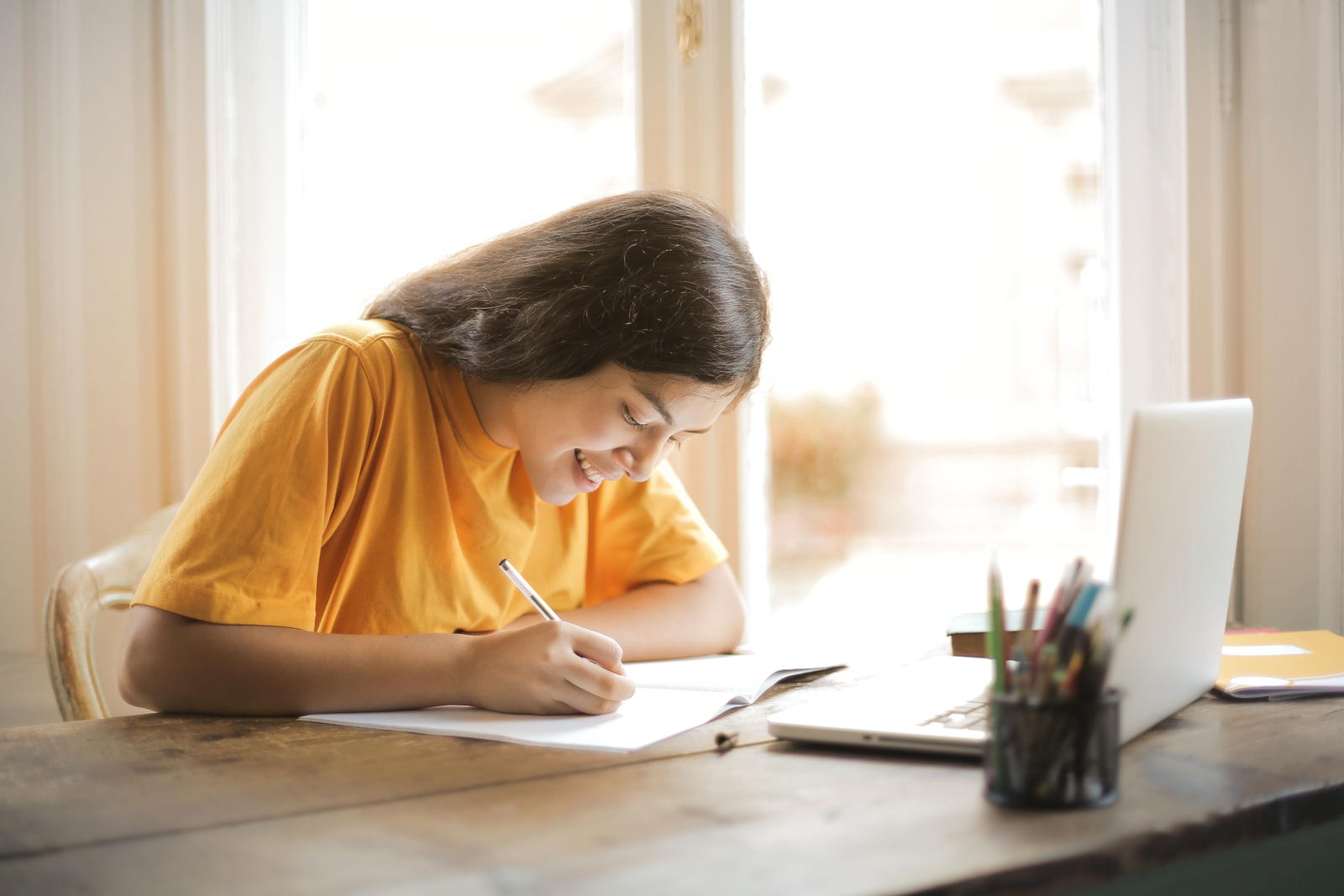 Parent and child working through English workbook together showing confusion