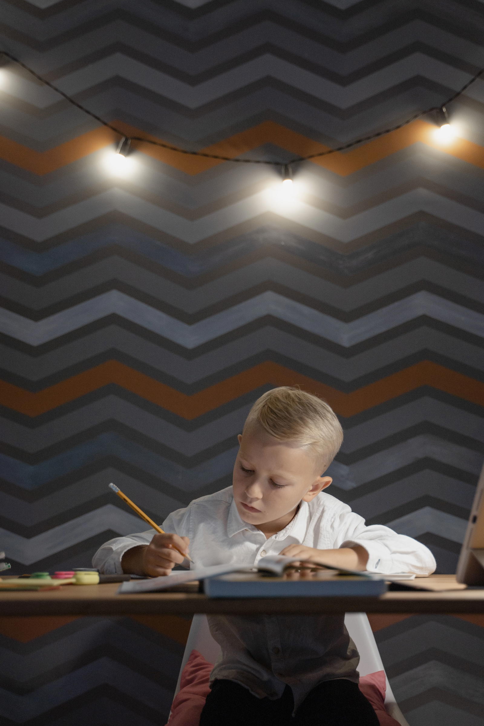 Child focused on homework at desk