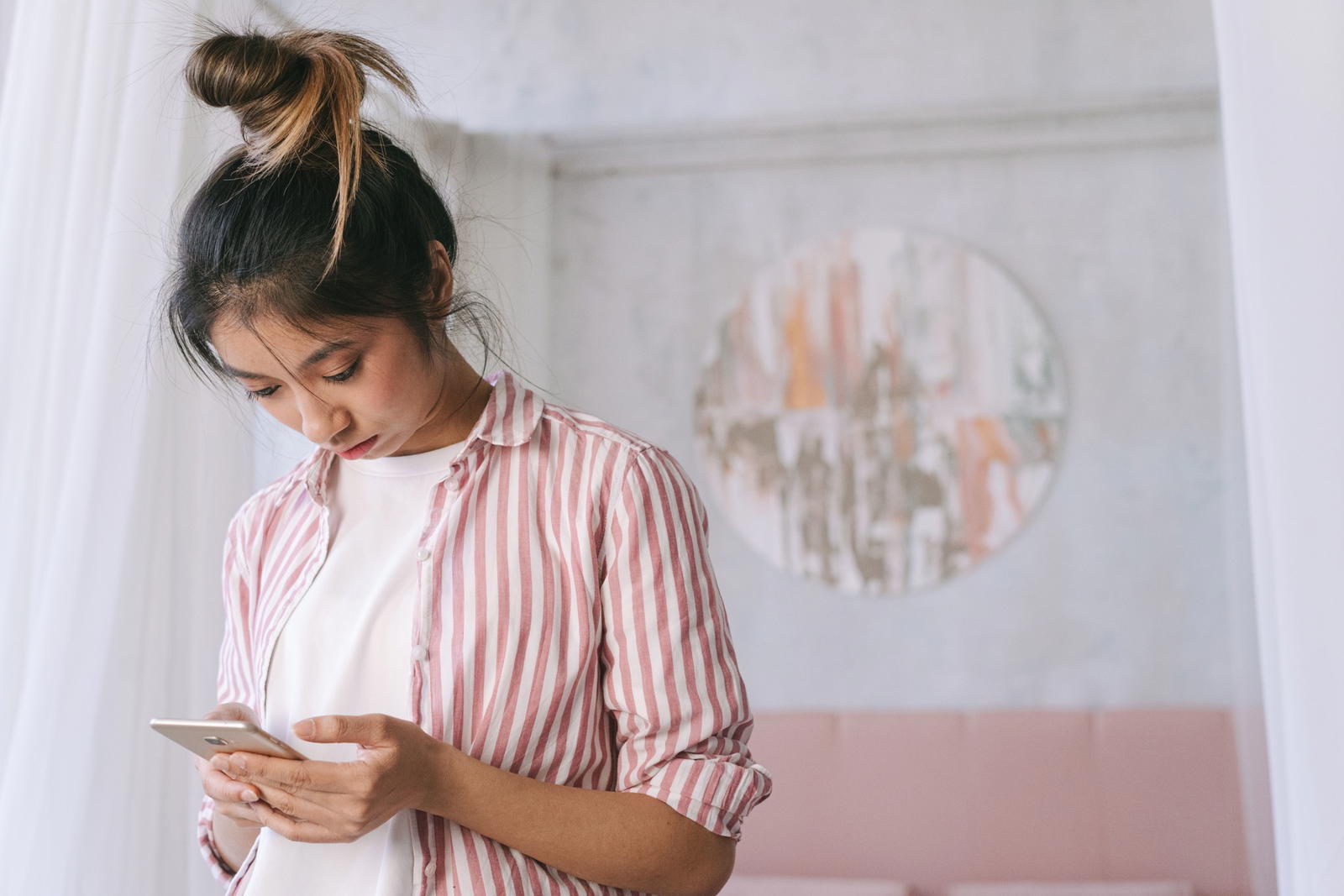 Woman checking her phone for test results
