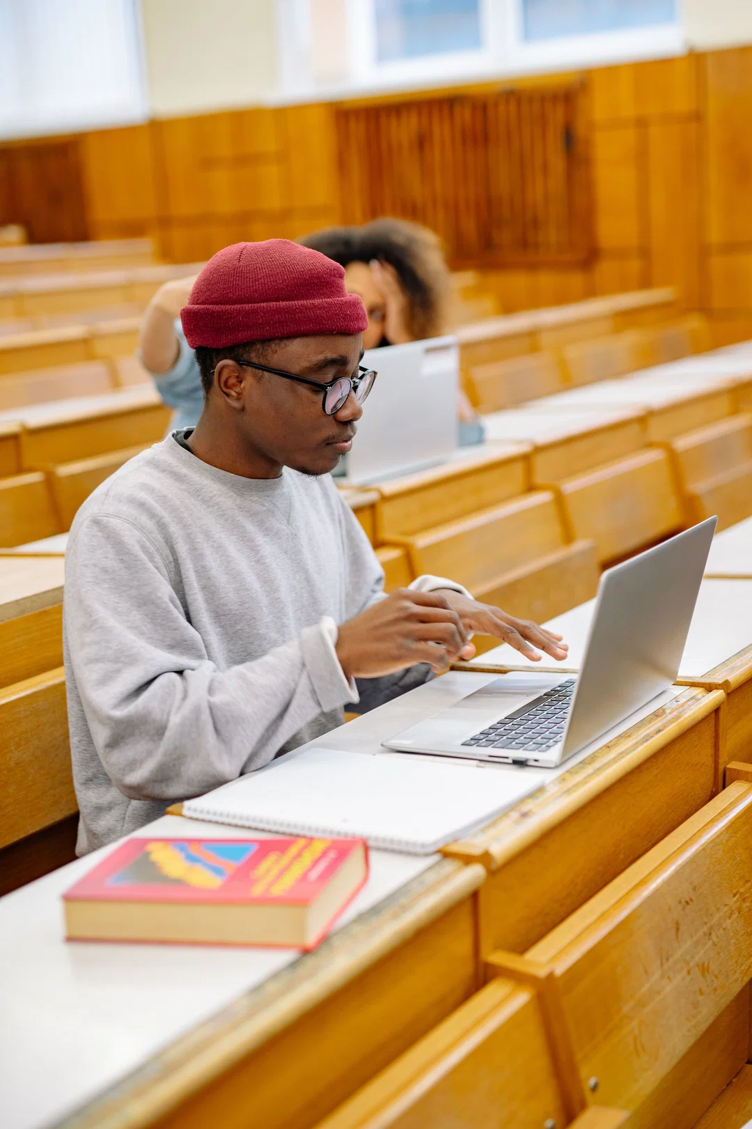 Student taking an online English test on a laptop